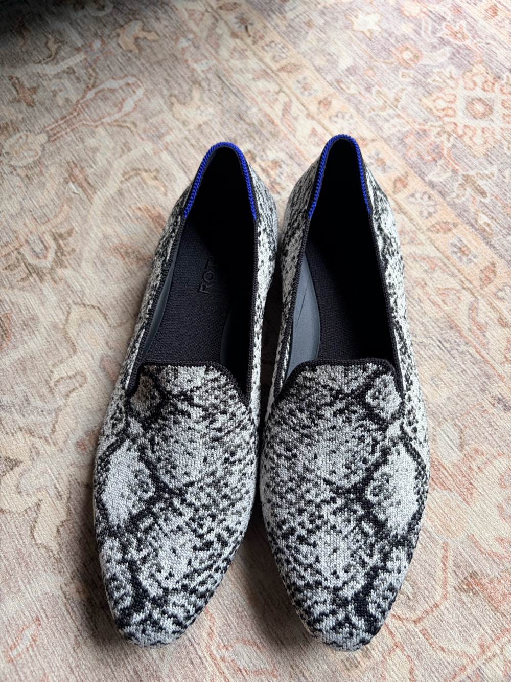 Rothy's Black and White Snake-Print almond loafers